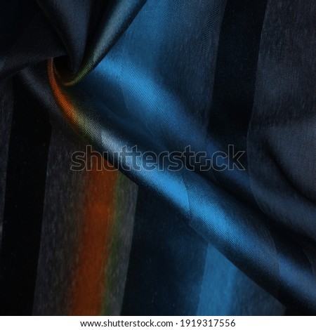 The silk scarf is dark in color. Cyan Green Blue blurred stripes. Delicate long gradient color stole, soft hand feeling, stylish and comfortable. The scarf will add sophistication to your Design.