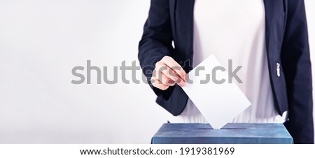 Banner of a voter putting vote in the ballot box. Election concept. Royalty-Free Stock Photo #1919381969