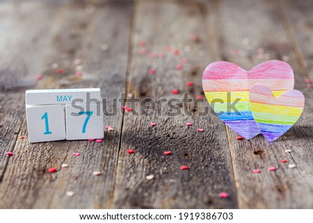 Wooden calendar with date 17 May and heart painted in rainbow color. International Day Against Homophobia, Transphobia and Biphobia. LGBT. Copy space. Royalty-Free Stock Photo #1919386703