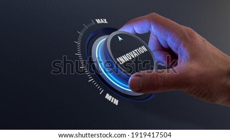 Enhancing innovation and technology development concept with a person choosing higher innovative products by turning a knob or dial by hand. Business strategy about engineering and research. Royalty-Free Stock Photo #1919417504