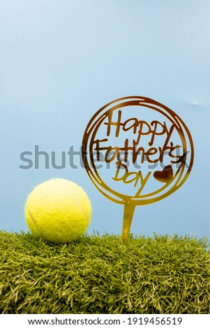 Tennis with Happy Father's Day are on blue sky background