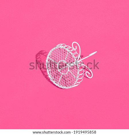 White metal table on bright pink background. Creative trendy layout with sunshine and hard shadow. Cafe, restaurant, summer minimal concept.
