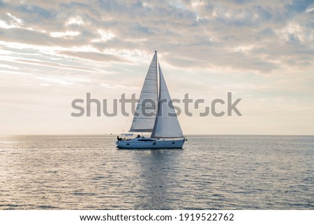 Sailboat in the sea in the sunset, luxury summer adventure, in Mediterranean sea, Europe Royalty-Free Stock Photo #1919522762