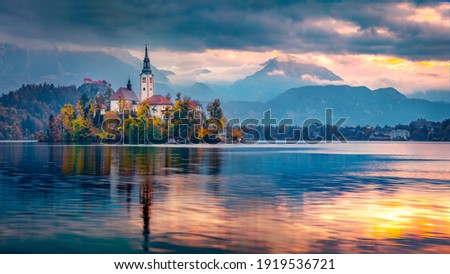 Сharm of the ancient cities of Europe. Panoramic morning view of Pilgrimage Church of the Assumption of Maria. Exciting autumn scene of Bled lake, Julian Alps, Slovenia, Europe.  Royalty-Free Stock Photo #1919536721