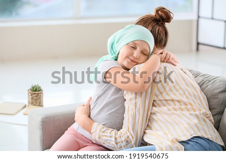 Little girl after chemotherapy with her mother at home Royalty-Free Stock Photo #1919540675
