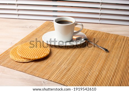 Coffee with waffles on the table Royalty-Free Stock Photo #1919542610