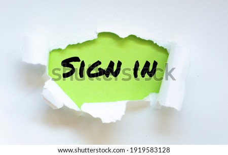 Sign in text appearing behind white color paper