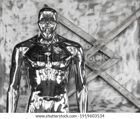 futuristic metal mannequin on iron background