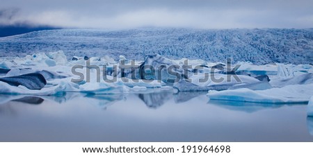 Beatufil vibrant picture of icelandic glacier and glacier lagoon with water and ice in cold blue tones, Iceland, Glacier Bay 