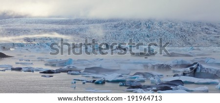 Beatufil vibrant picture of icelandic glacier and glacier lagoon with water and ice in cold blue tones, Iceland, Glacier Bay 