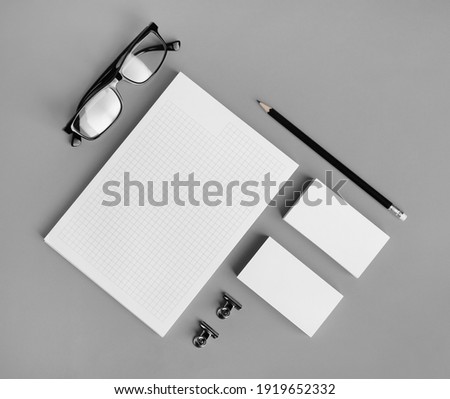 Blank branding identity set on gray paper background. Corporate stationery template. For design presentations and portfolios. Flat lay.