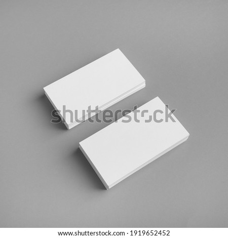 Blank business cards template on gray paper background. Template for graphic designers portfolios.