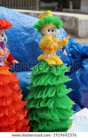 hand made puppets are being sold in Rajasthan,India with selective focus. Close up pic of dolls, women face with traditional western makeup wearing colorful frock with copy space.Souvenirs dolls.
