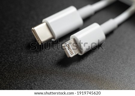 charging cables for phone on black background