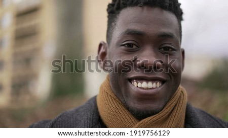 Happy satisfied black African portrait face close-up smile, charismatic friendly