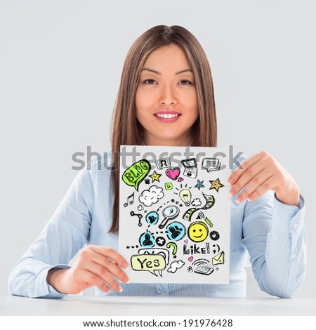Business woman holding a sign with online services symbols