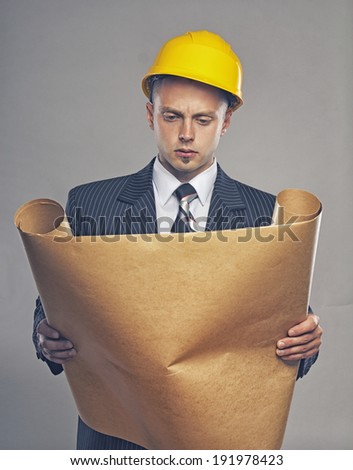 Image of engineer reading map