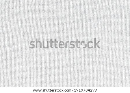 White natural texture of knitted wool textile material background. White crochet cotton fabric woven canvas texture. close up Royalty-Free Stock Photo #1919784299
