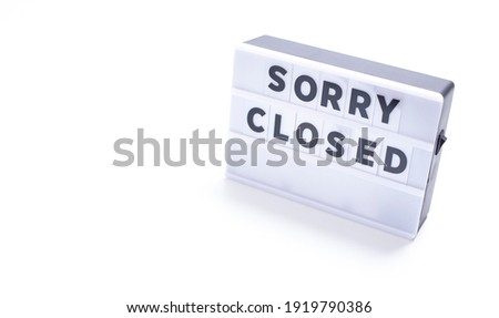 sorry closed,   words on lightbox on white background flat lay. 