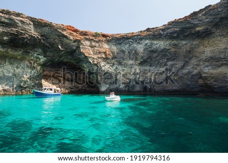 Pleasure boats at Blue Lagoon of Comino, Malta Royalty-Free Stock Photo #1919794316