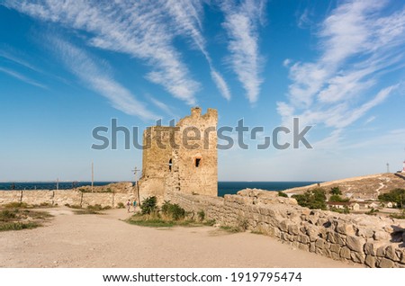The ancient Genoese fortress of Kafa in Feodosia on the Black Sea coast. The Crisco Tower is the southern bastion. Popular tourist attraction of the city Royalty-Free Stock Photo #1919795474