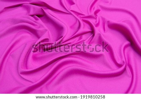 The texture of silk fabric in fuchsia. Background, pattern Royalty-Free Stock Photo #1919810258