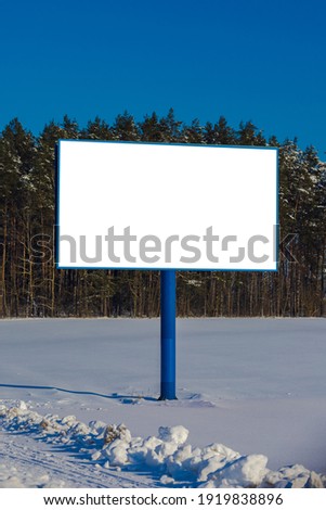 Background for design. Advertising billboard along the road in the city on a winter sunny day