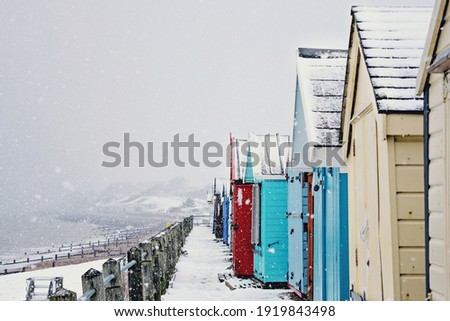 Felixstow beach huts in the snow, Suffolk, England Royalty-Free Stock Photo #1919843498