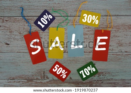 word sale on wooden background. Promotion or sale advertisement concept
