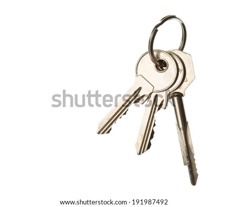 three key on ring over white background