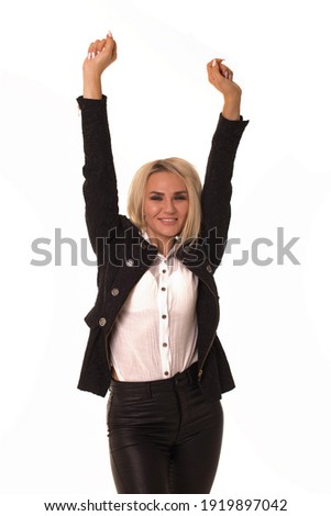 Beautiful blonde girl raised her hands up and rejoice. Woman stands on a white background and rejoices.