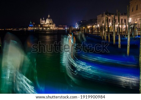 Gondolas and Santa Maria della Salute at night, Venice, Veneto, Italy