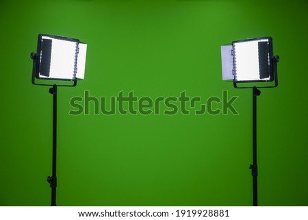 Green screen television studio with two fill lights  Lights are on in chroma studio, green screen studio