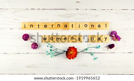 International Women's Day.words from wooden cubes with letters photo