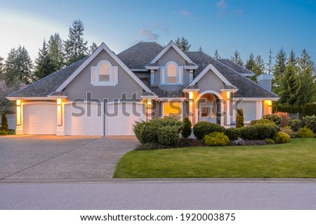 Luxury house at night in Vancouver, Canada. Royalty-Free Stock Photo #1920003875