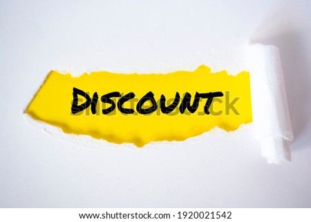 Discount, word written under torn paper Image.