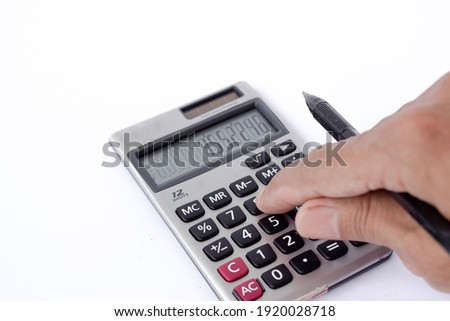Close up photo of finger and calculator to calculate economy and finance money,OFFICE EQUIPMENT