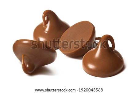 Milk chocolate drops or chips isolated on white background. Package design element with clipping path Royalty-Free Stock Photo #1920043568
