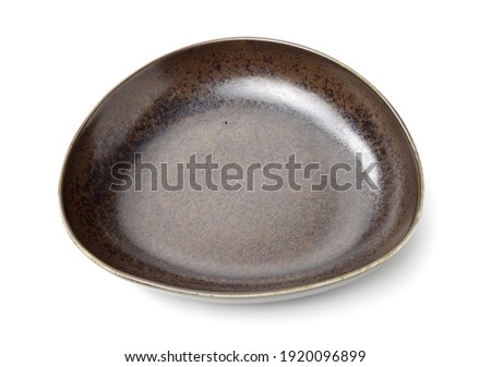 Empty earthenware plate on white background