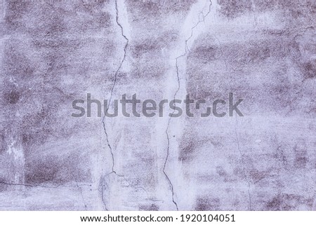 A high resolution old concrete cement with cracks and natural destruction from time and weather conditions.