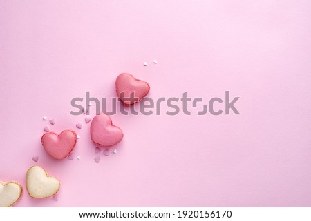 Valentine's background with heart-shaped macaroons in pink tones with space for text