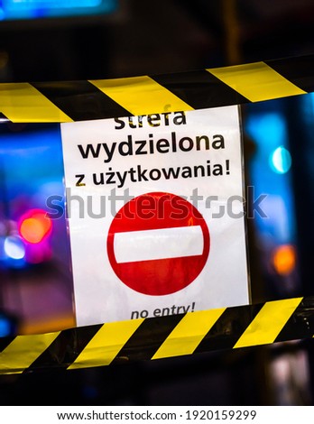 Translation "Restricted area, no entry!" Bus sign at night telling not to cross the tape beacuse of coronavirus to keep bus drivers safe
