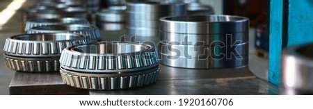 Ready-made large-diameter bearings. Metal products. A narrow banner.Heavy industry. Shop at the factory. Without people. Royalty-Free Stock Photo #1920160706