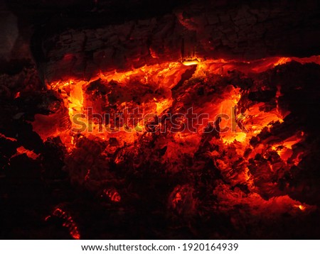 Decaying coals for cooking and a background