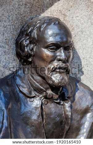 Dante Gabriel Rossetti memorial statue bust from its drinking fountain unveiled in 1887 beside the River Thames in Cheyne Walk Chelsea London England UK who was an English poet and painter stock photo