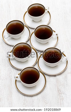 Cups with black tea or coffee
