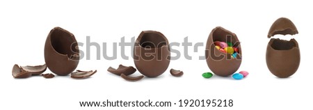 Set with broken chocolate eggs on white background, banner design Royalty-Free Stock Photo #1920195218