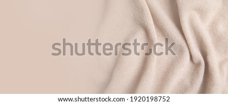 Warm cashmere fabric as background, top view with space for text. Banner design Royalty-Free Stock Photo #1920198752
