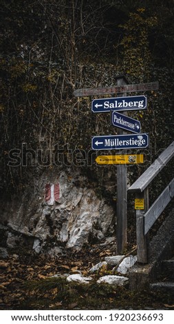 Directional signage in German language.the first one is world heritage circular, Salzburg city, Parking terrace, Müllerstiege street, Salzkammergut and Soleweg town.