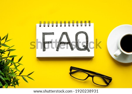 FAQ on office desk. Working with clients concept